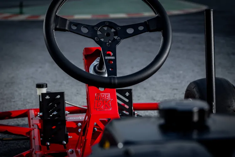 Close photograph of the drift kart's steering wheel. 